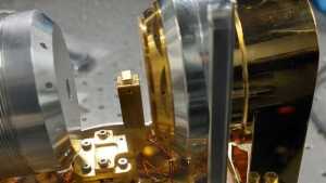 A TMD-coated optical fiber installed in a custom waveguide testing cryostat.
