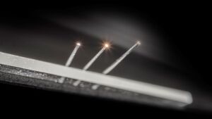 Exposed core fibers functionalized with 2D-Materials are scalable platform for photonics.